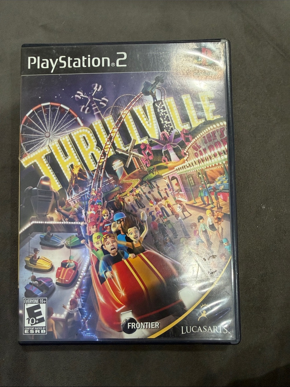 Sony PlayStation 2 Thrillville — Vibrant Yellow & Red Cover
